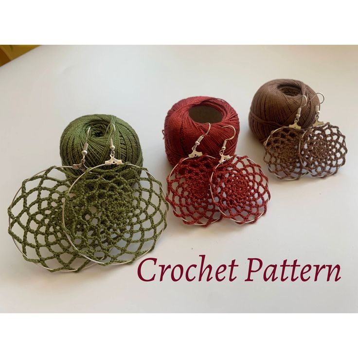 four crochet earrings are sitting on a table with the words crochet pattern below them