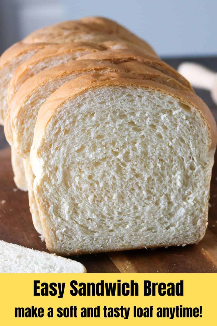 a loaf of bread sitting on top of a cutting board with the words easy sandwich bread make a soft and tasty loaf anytime