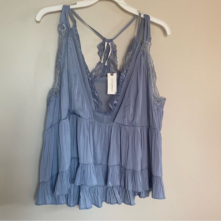 New With Tags. In Excellent Condition With No Flaws. Sleeveless. Lace Trim. Ruffle. Babydoll. Satin. Lightweight. Boho. Coastal Cowgirl. Versatile. Night Out. Party. Loose Fit. Relaxed Fit. Preppy. Cottagecore. Blue Tops With Lace Trim For Vacation, Blue Spring Camisole For Loungewear, Spring Blue Camisole For Loungewear, Blue Camisole For Spring Loungewear, Bohemian Blue Tops With Spaghetti Straps, Ruffled Camisole For Spring Loungewear, Blue Ruffled Camisole For Spring, Blue Ruffled Tops For Loungewear, Spring Blue Camisole With Ruffles