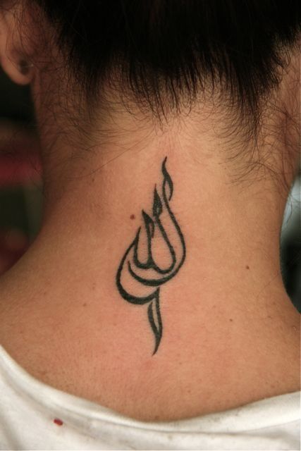 a woman with a tattoo on her neck