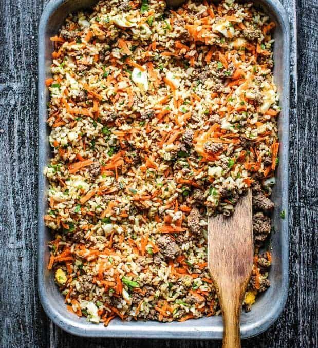 a casserole dish filled with ground beef and carrots