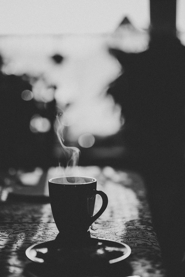 a coffee cup with steam rising out of it