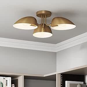 a ceiling light with three lights on top of it in a room that has bookshelves