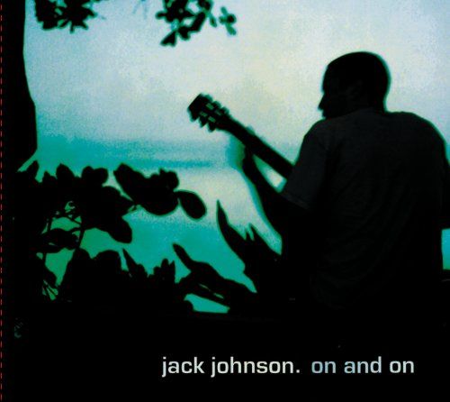 the silhouette of a man playing an acoustic guitar in front of a lake and tree