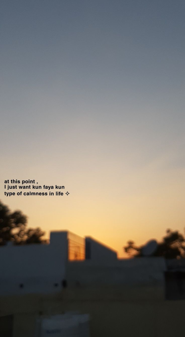 the sun is setting behind a building with a poem written on it that reads, at this point i don't want to run but someone else