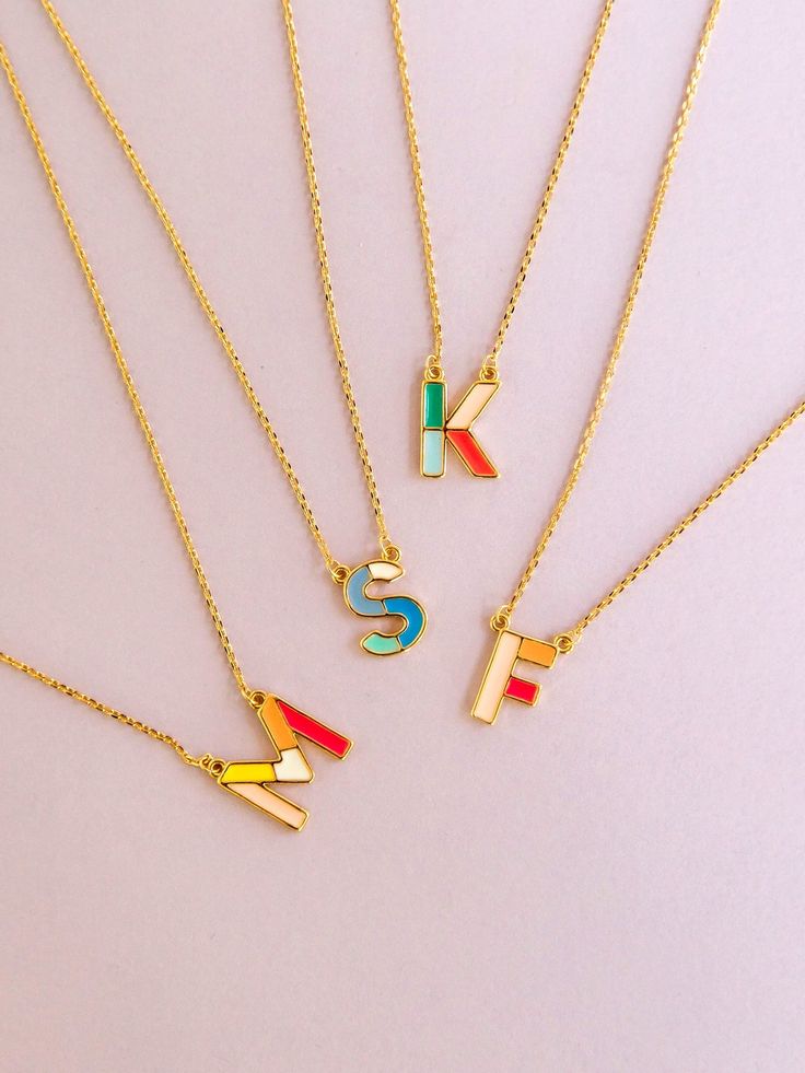 Initial jewelry but make it colorful, the Oliva Luxe Initial Necklace is perfectly on trend. 18K gold plated initial charm necklace with enamel inlay .5" charm 16" with 3" extender Hypoallergenic Nickel and lead free Alphabet Jewelry, Pride Jewellery, Alphabet Necklace, Fits Clothes, Mama Style, Enamel Necklaces, Initial Jewelry, Enamel Charms, Letter Necklace