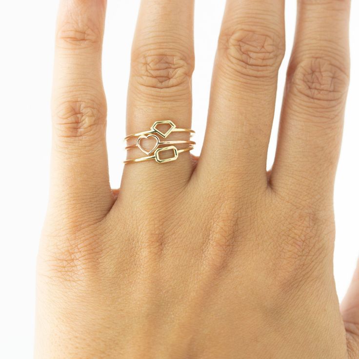 Show your love for her with our shaped dainty ring. It features a light dainty band, and a cute heart shape on top to always remind her of your love. Stack great with our other rings as well! Available in your choice of: Solid 14k & 18K Golds, Silver, or Gold Plated over Silver Base 1.2mm-1.4mm average width Simple Adjustable Heart Ring For Anniversary, Dainty Heart Ring With Simple Design For Promise, Dainty Open Heart Midi Rings For Anniversary, Dainty Simple Design Heart Promise Ring, Minimalist Heart Shaped Stackable Promise Rings, Minimalist Open Heart Midi Rings For Anniversary, Rose Gold Midi Rings With Simple Design For Promise, Promise Rose Gold Midi Rings With Simple Design, Dainty Adjustable Initial Ring For Anniversary