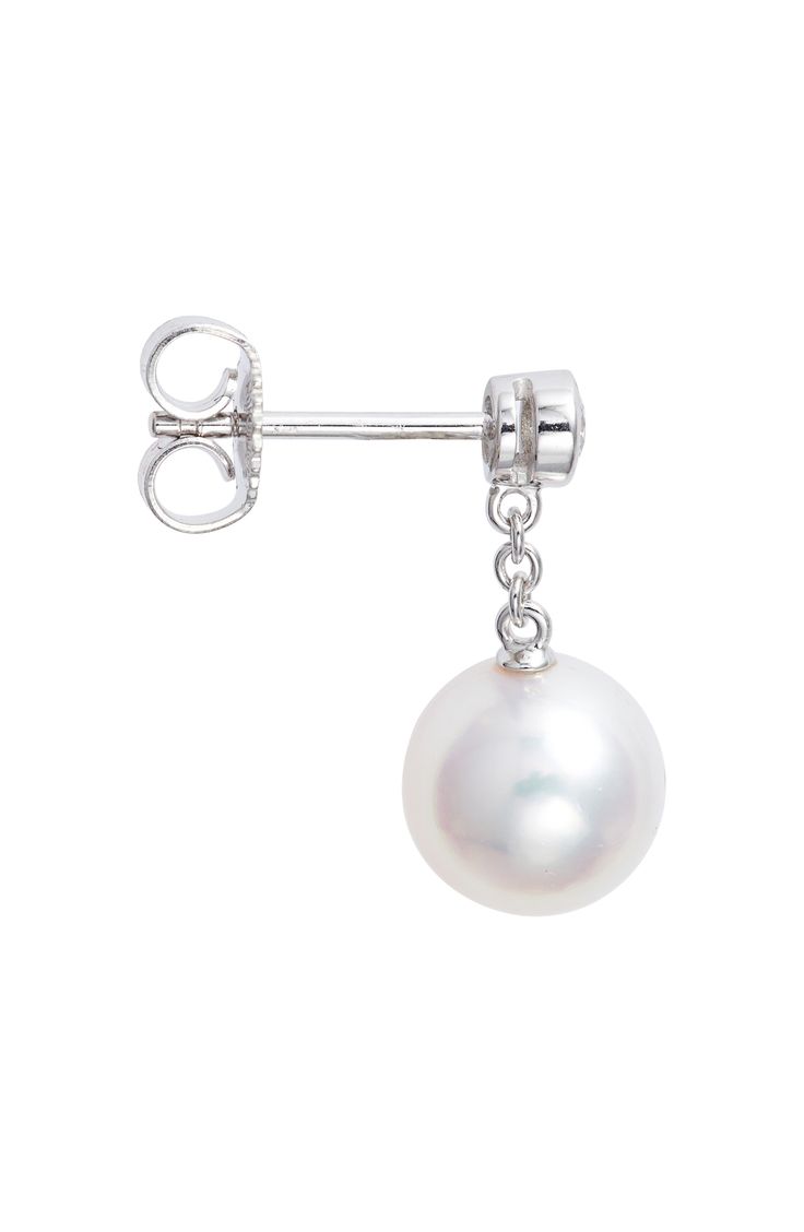 Bezel-set diamonds anchor these cultured pearl drop earrings that swing and sway from dainty 18-karat gold chains. Total diamond weight: 0.16ct. Color: F–G Clarity: VS1 Pearl size: 8–8.5mm Cultured pearl/18k gold/diamond Made in Japan >Diamond Guide Asian Owned/Founded Diamond Guide, Bezel Set Diamond, Pearl Size, Pearl Drop Earrings, Pearl Drop, Cultured Pearls, Bezel Setting, Gold Chains, Made In Japan