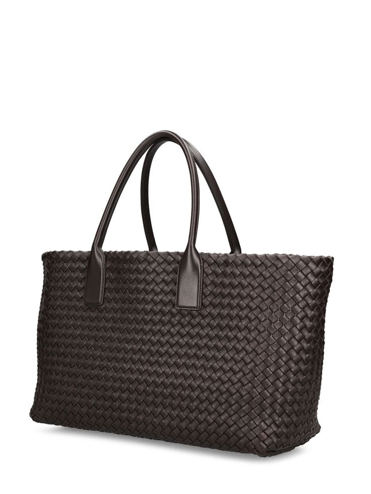 Find BOTTEGA VENETA Cabat Leather Tote Bag on Editorialist. The BOTTEGA VENETA Cabat tote bag features a woven leather exterior and lining with gold-colored metal hardware. The bag has double top handles with a 19cm drop. It includes a matching zip pouch. The bag measures 29cm in height, 40cm in width, and 16cm in depth. Ski Accessories, Loafer Mules, Sports Accessories, Flat Espadrilles, Zip Pouch, Swim Accessories, Heeled Loafers, Metal Hardware, Leather Tote Bag