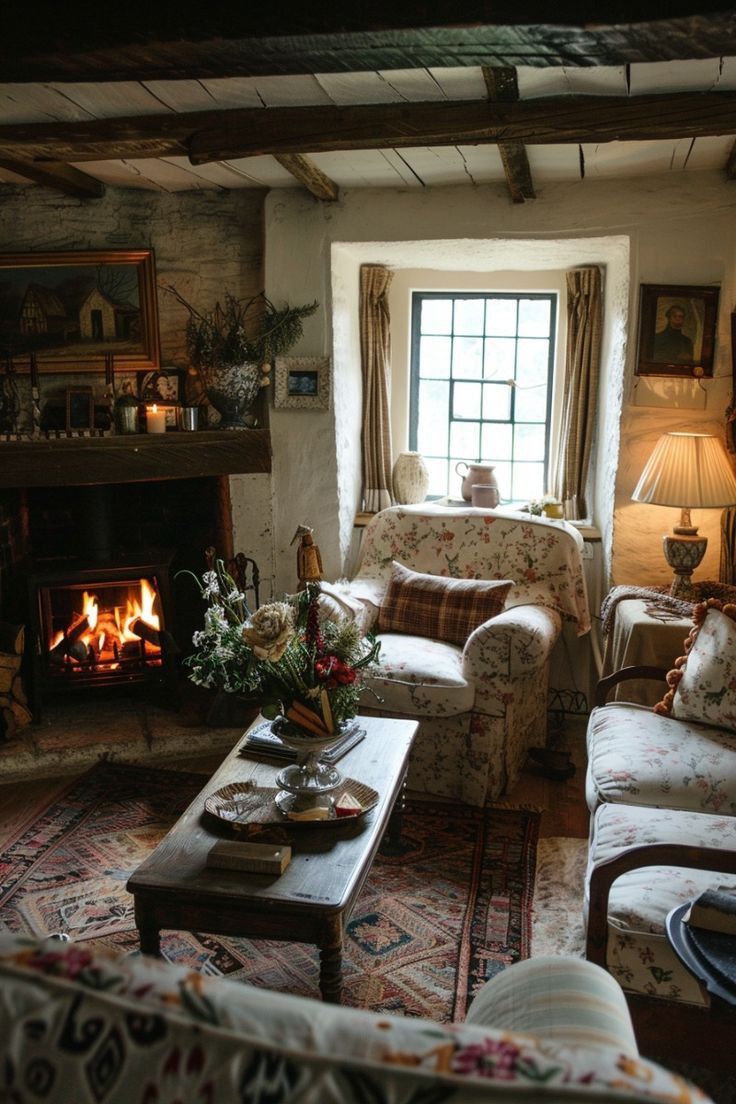 a living room filled with furniture and a fire place next to a window in front of a fireplace