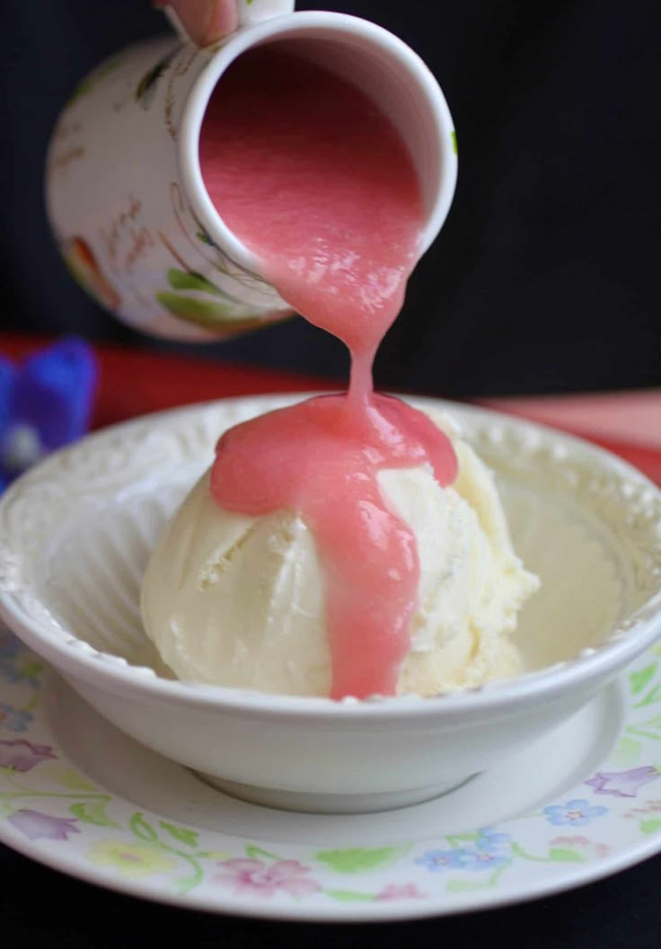 someone is pouring ice cream into a bowl