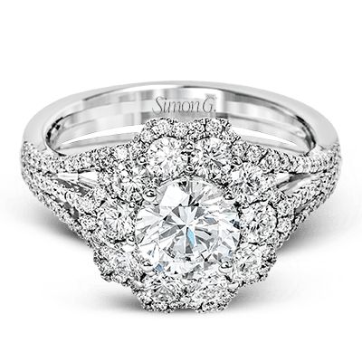 a diamond engagement ring with two halos in the center