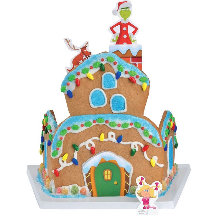 an elaborate gingerbread house decorated with icing and decorations