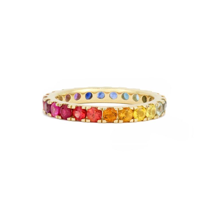 The Stevie Wren Jumbo 14k Gemstone Eternity Band is a stunning piece of jewelry that exudes elegance and charm. This exquisite ring features a dazzling rainbow ombre of paved gemstones, totaling 1.89 carats, creating a vibrant and eye-catching display. The full round cut gemstones are meticulously micro pave set, showcasing precision and attention to detail.Designed with versatility in mind, this band can effortlessly stack together with your favorite ring or make a bold statement on its own. Th Rainbow Multi-stone Diamond Jewelry, Rainbow Diamond Jewelry With Multi-stone, Rainbow 14k Gold Stackable Jewelry, Luxury Rainbow Cubic Zirconia Jewelry, Luxury Multi-stone Yellow Gold Eternity Band, Luxury Yellow Gold Multi-stone Eternity Band, Luxury Yellow Gold Eternity Band With Multi-stone, Rainbow Multi-stone 14k Gold Jewelry, Round Rainbow Stones Jewelry