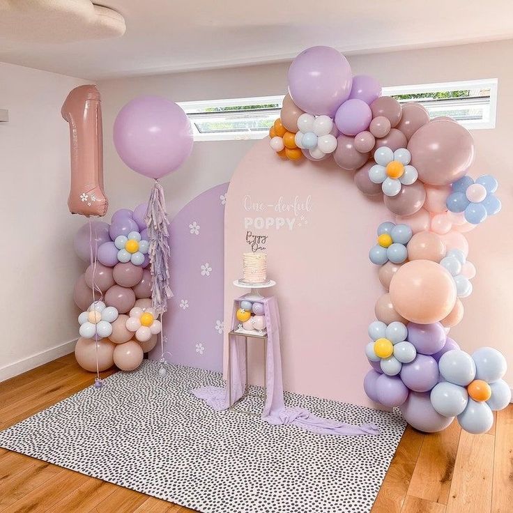 a room decorated with balloons and decorations