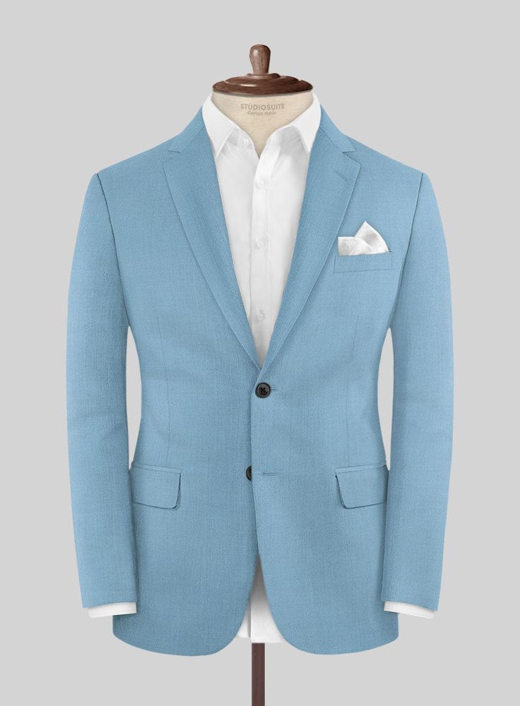 Bring some passion to your wardrobe with our finely tailored Napolean Taj Blue Wool suit. Crafted from a wool blend, the suit will make you look sharp with minimal effort and see-through event after event. Style it with a matching waistcoat, a white shirt, patterned blue tie and tanned brown derby shoes. 
 
Look Includes   Napolean Taj Blue Wool Fabric  Two Button Jacket Style  Notch Lapel  Horn Royal Black Buttons  Single Vent  Three Cuff Buttons  Two Welted Back Pockets on Trousers    Click 'C Brown Derby, Button Jacket, Wool Suit, Blue Tie, Derby Shoes, Blue Ties, Blue Wool, Jacket Buttons, Black Button