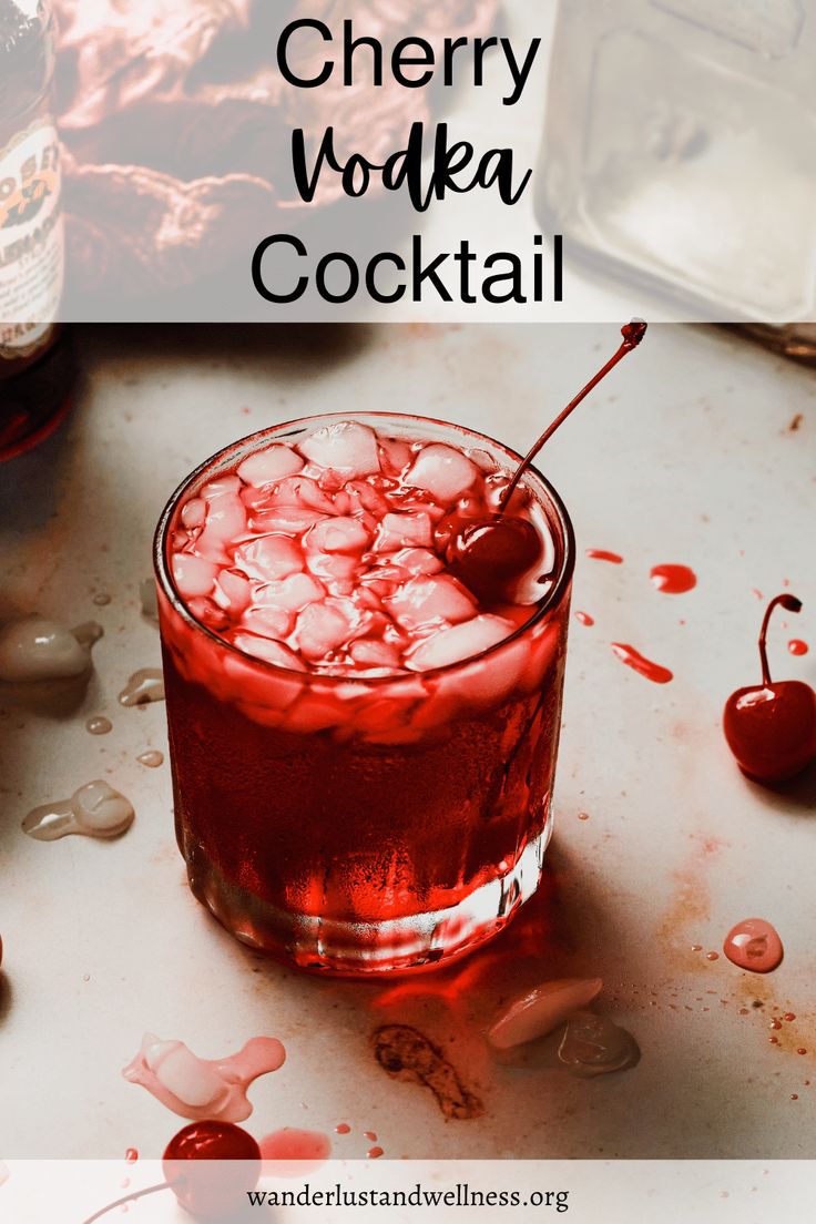 cherry vodka cocktail in a glass with ice and cherries