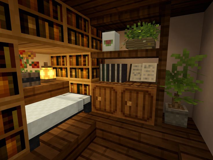 a bed in a room filled with lots of wooden bookshelves next to a plant