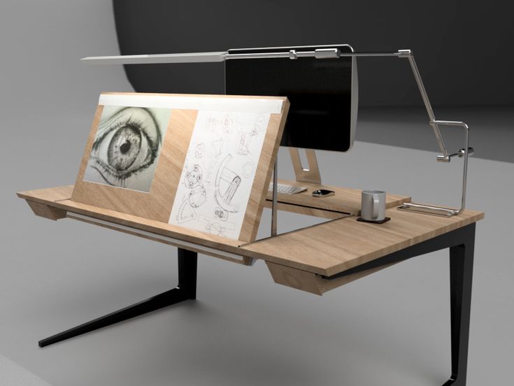 a computer desk with an eye drawn on it