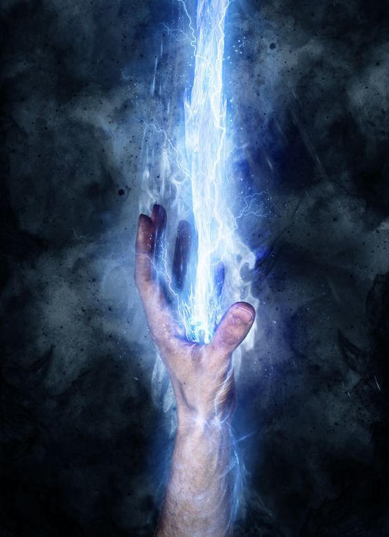 a hand holding a glowing blue object in the air