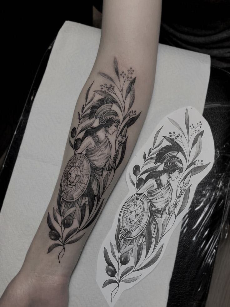 a person with a tattoo on their arm next to a piece of paper that has a clock and flowers on it