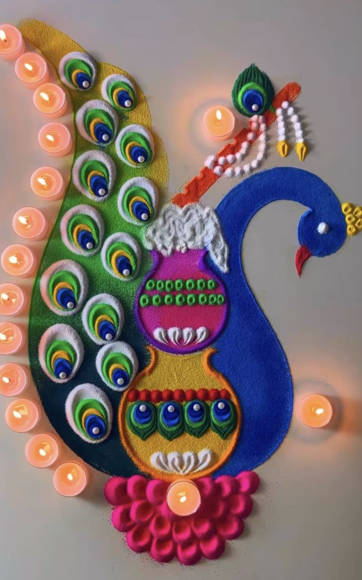 a peacock made out of felt with candles on the wall in front of it,