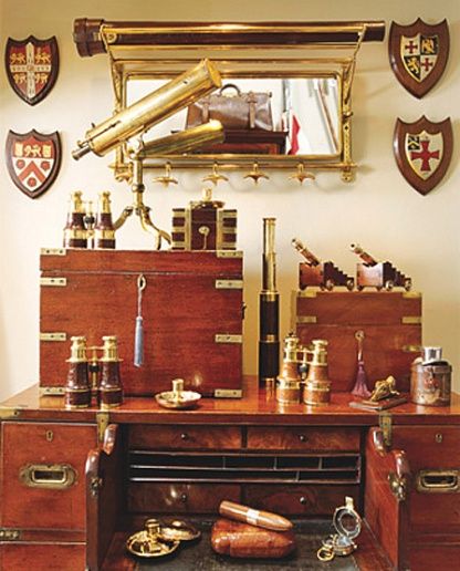 an old fashioned desk with lots of items on it