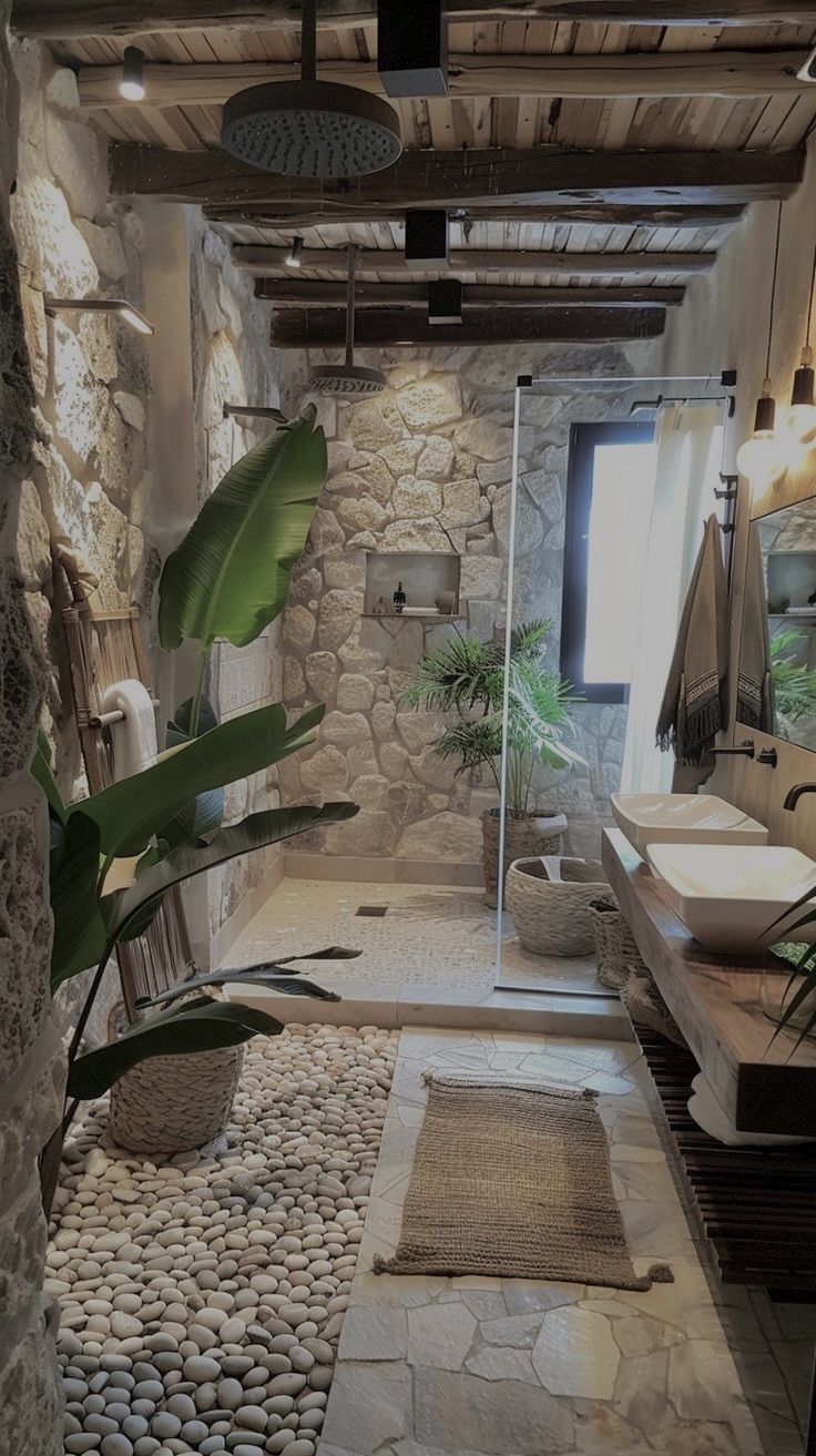 a bathroom with stone walls and flooring