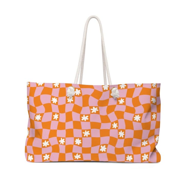 "Our Groovy Daisy oversized Weekender Tote is perfect for your weekend at the beach or in town. The wide-mouthed, durable bag holds a generous amount of personal items and is easily held by its thick rope handles. : 100% Spun Polyester : T-bottom : Cream sheeting interior lining : One size: 24\" x13\" (60.9 cm x 33 cm)" Trendy Weekend Bags For Spring, Rectangular Bags For Weekend In Spring, Rectangular Bags For Weekend Spring, Rectangular Bags For Spring Weekend, Rectangular Weekend Bag For Spring, Casual Weekend Bag For Spring, Rectangular Spring Weekend Bag, Pink Tote Beach Bag For Weekend, Pink Tote Weekender Bag