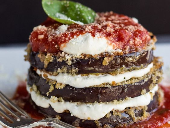 a stack of desserts on a plate with a fork