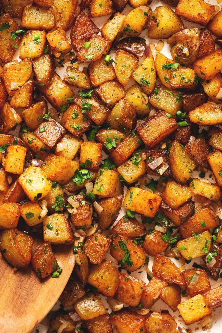 cooked potatoes with parsley in a skillet