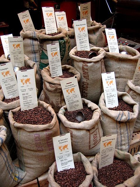 bags filled with coffee beans sitting next to each other