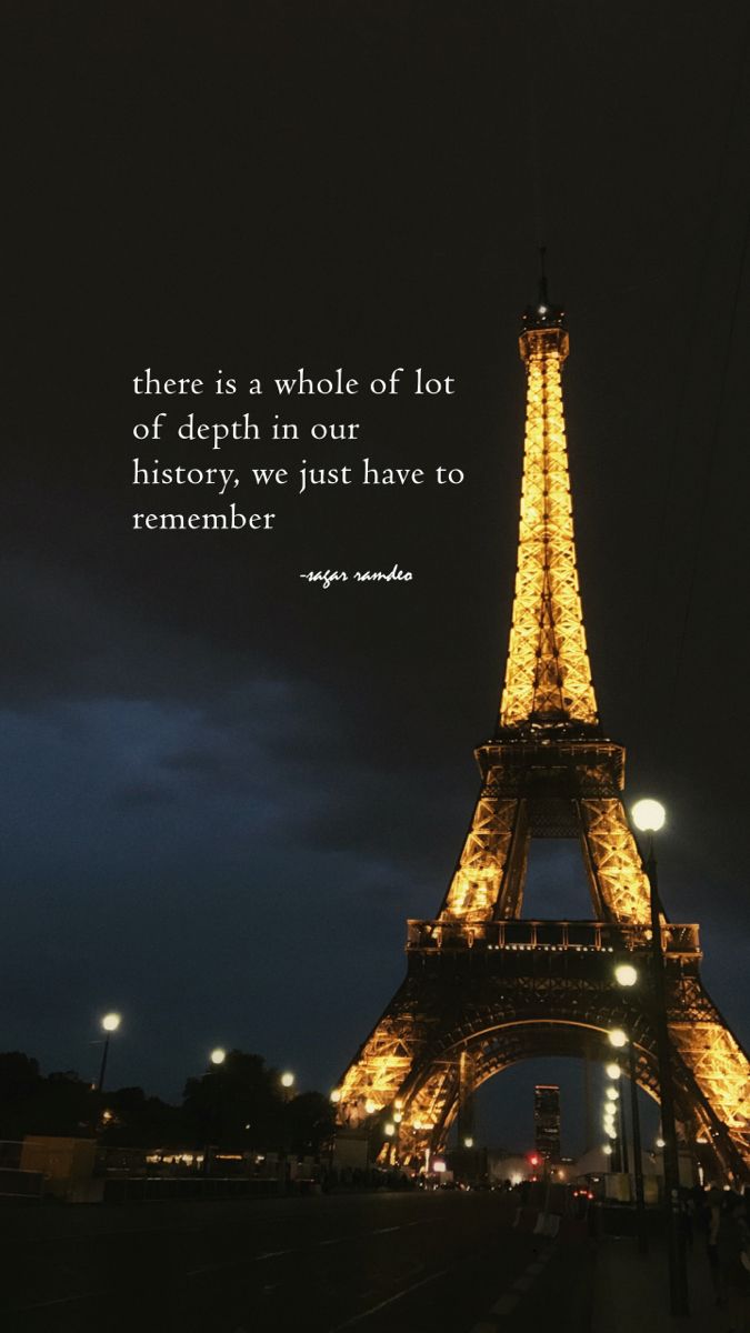 the eiffel tower lit up at night with an inspirational quote about being in paris