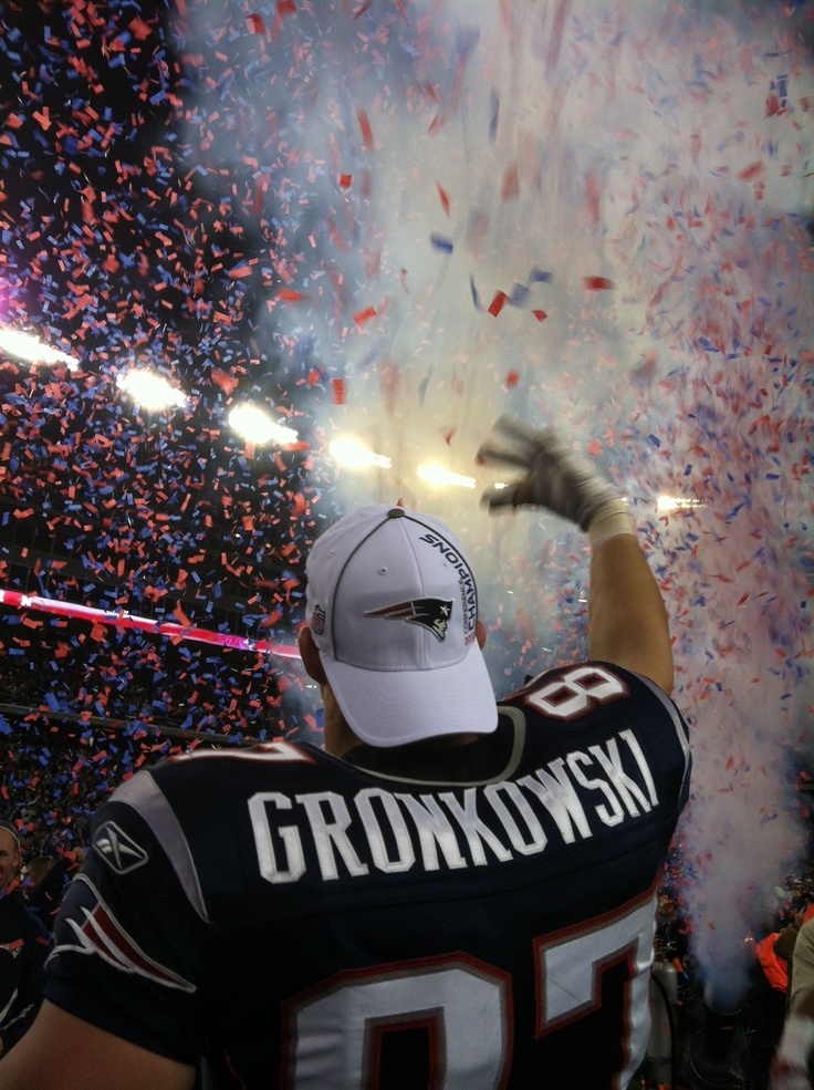 a football player is celebrating with confetti in the air