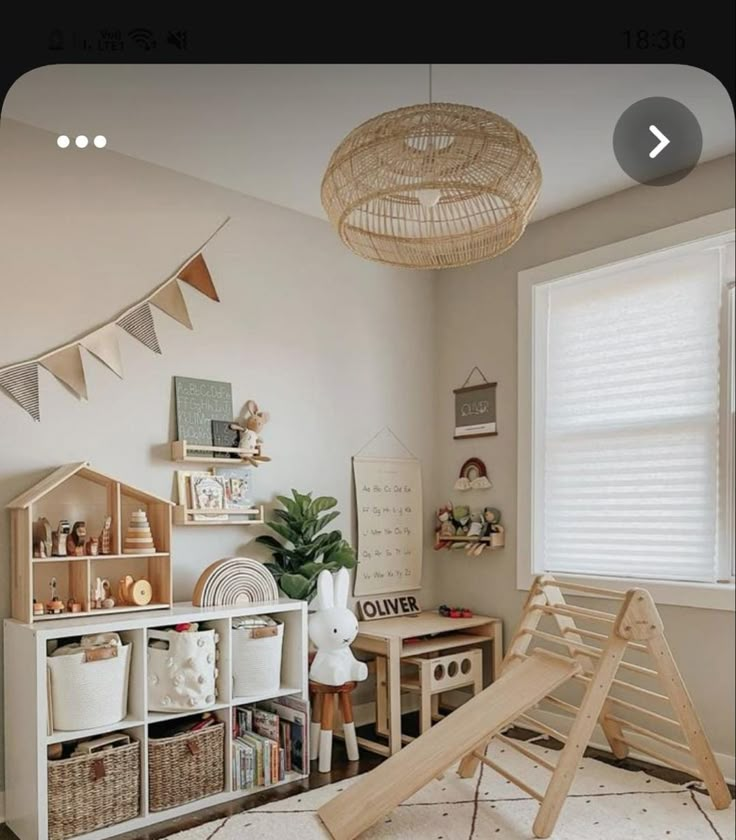 a child's room with toys, bookshelves and other items in it