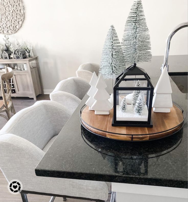 a dining room table with christmas trees on it