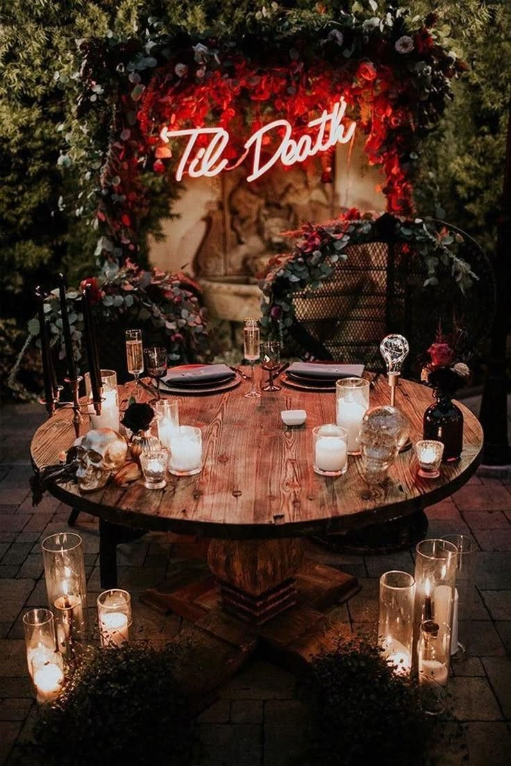 a wooden table topped with lots of candles