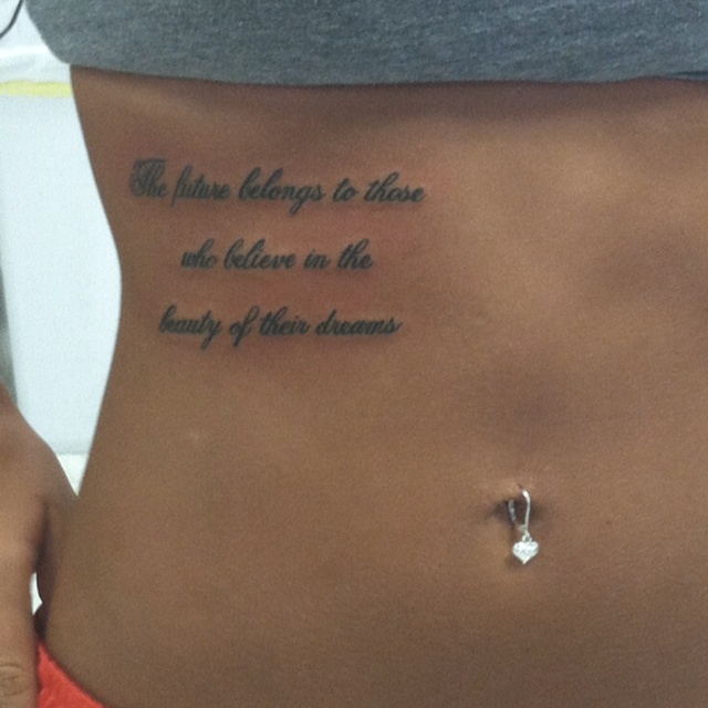 a woman with a tattoo on her stomach saying, the things belongs to those who believe in the beauty of other dreams