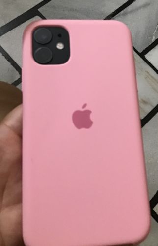 the pink iphone case is in someone's hand