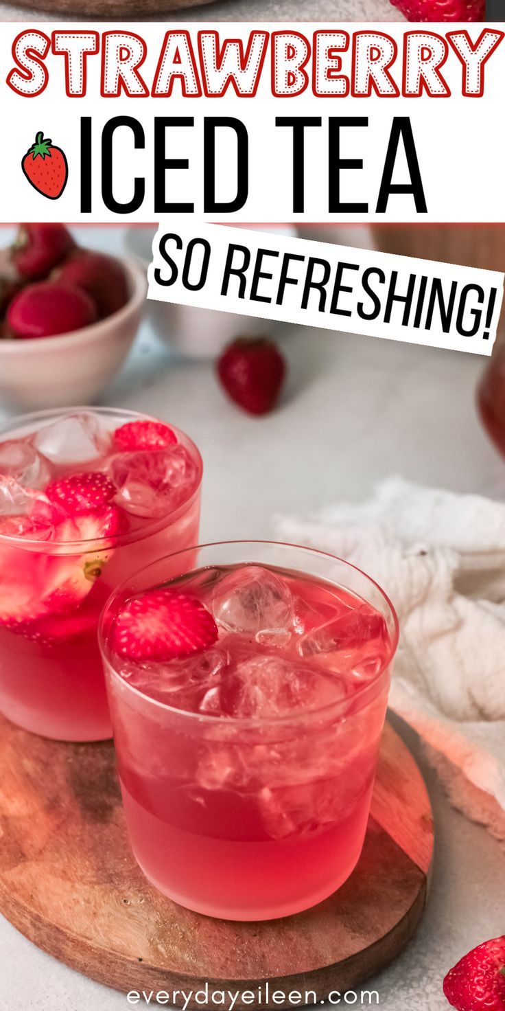 two glasses filled with ice tea on top of a cutting board next to strawberries