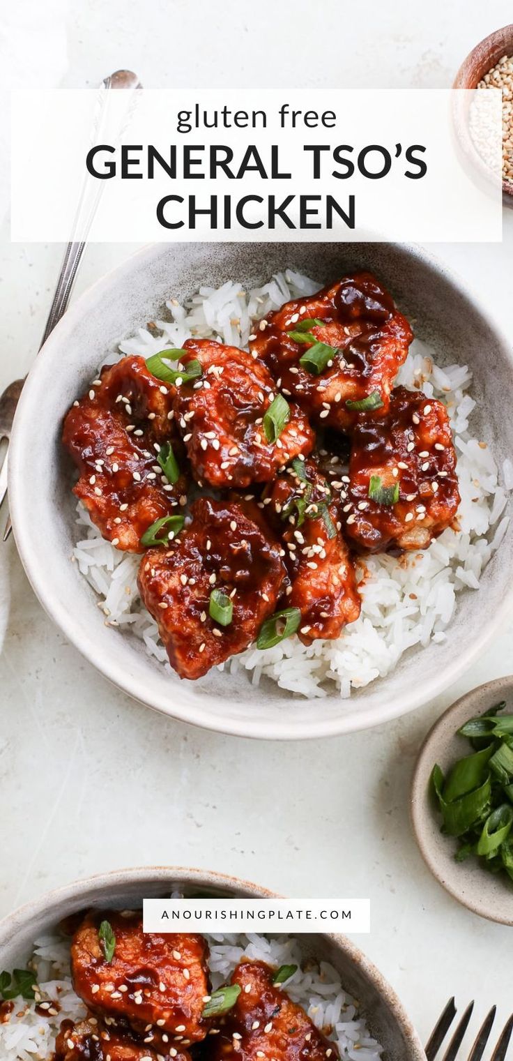 two bowls filled with chicken and rice on top of a white table next to silverware