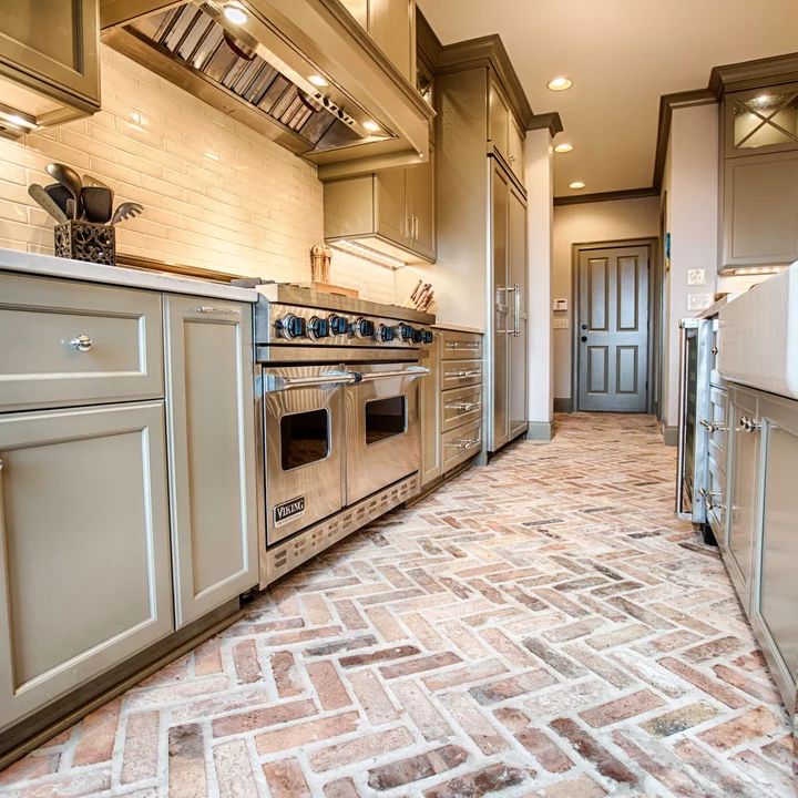 a kitchen with an oven, stove and sink