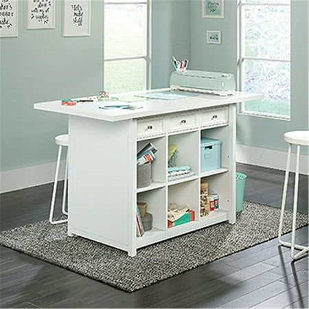 a white kitchen island with two stools and a sewing machine on the counter top