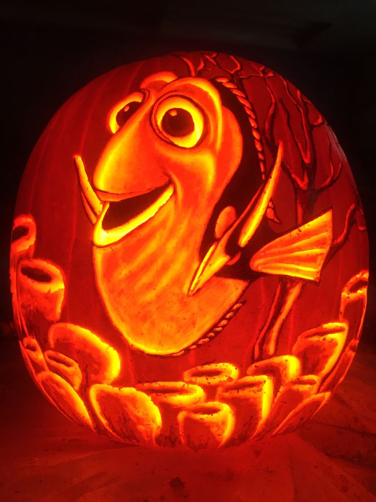 a carved pumpkin with an image of a fish on it