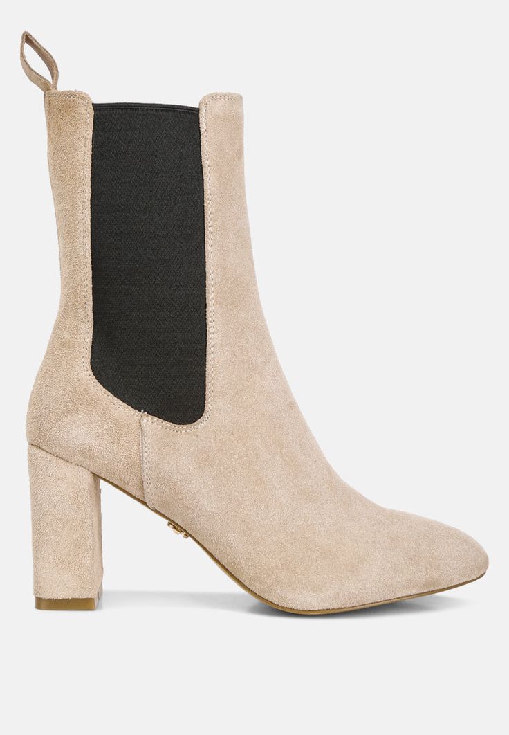 Discover the epitome of chic with these high ankle suede Chelsea boots! Their comfortable cushioned insoles make them an effortless pair to wear and style. Their versatility allows maximum wearability and makes them a staple in every shoe wardrobe. Type: Boots Upper Material: Suede Light Cushion Insole Outer Sole: TPR Block Heels Closed Almond Toe Elasticated Gussets Pull Tabs High Ankle Boots RCSH4340 Trendy Suede High Ankle Mid-calf Boots, Trendy Suede Mid-calf High Ankle Boots, Trendy High Ankle Suede Mid-calf Boots, High Ankle Suede Chelsea Boots For Fall, Modern High Ankle Suede Heeled Boots, Trendy Suede Boots For Workwear, Modern Suede Ankle Boots, Beige Suede Mid-calf Boots, Suede Ankle Boots With Removable Insole