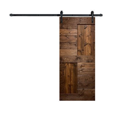 the sliding door is made from wood and has metal bars on each side, along with black hardware