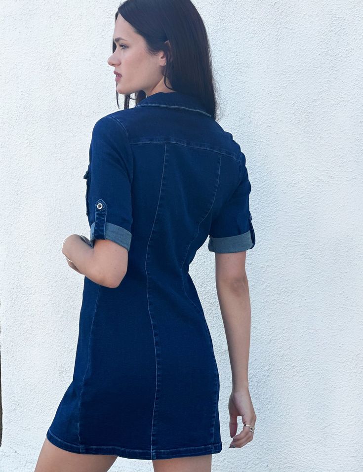 This utility shirtdress is cut from stretchy denim and meant to be worn whenever you're feeling extra-cute and carefree - AKA, everyday! The Model is 5' 9" wearing a size S Blue Collared Relaxed Fit Shirt Dress, Blue Relaxed Fit Collared Shirt Dress, Denim Shirt Dress With Short Sleeves In Medium Wash, Relaxed Fit Denim Shirt Dress With Short Sleeves, Blue Collared Shirt Dress With Relaxed Fit, Casual Collared Stretch Dress, Short Sleeve Denim Blue Shirt Dress With Buttons, Casual Stretch Collared Dress, Casual Indigo Dress With Buttons