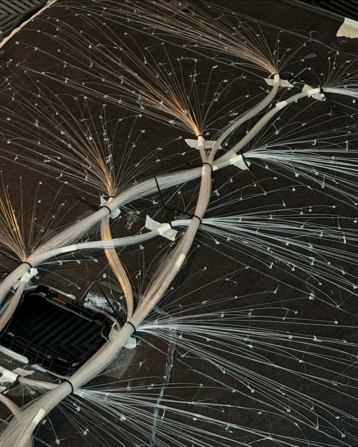 an overhead view of the inside of a building with wires attached to it's ceiling