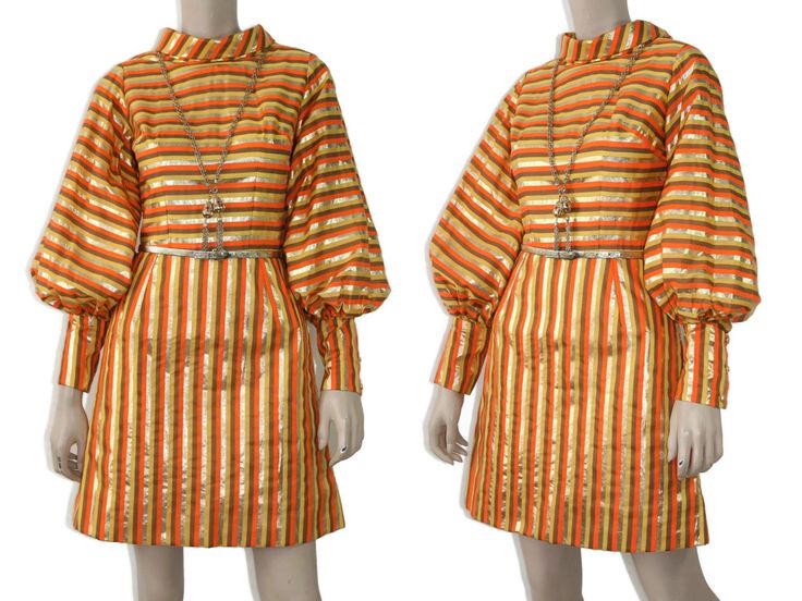 "This ultra mod 60s-era dress features a bold orange, yellow, and metallic gold striped print cotton fabric, high collar, voluminous balloon sleeves with long cuffs, fitted waist, and mini-length skirt. Dress is fully lined and zips up the back. Styling is very Twiggy-esque. Feels like a polished cotton fabric and could benefit from a good pressing, which I only fully realized after checking out my photographs. Best fits size xs or small (please refer to measurements below). Accessories not incl Mod Long Sleeve Dresses, Orange Mod Fitted Dress, Fitted Long Sleeve Mod Dress, Mod Orange Dress With Retro Print, Twiggy Dress, Twiggy Fashion, Yellow 60s Mod Dress, Balloon Skirt, Balloon Sleeve Dress