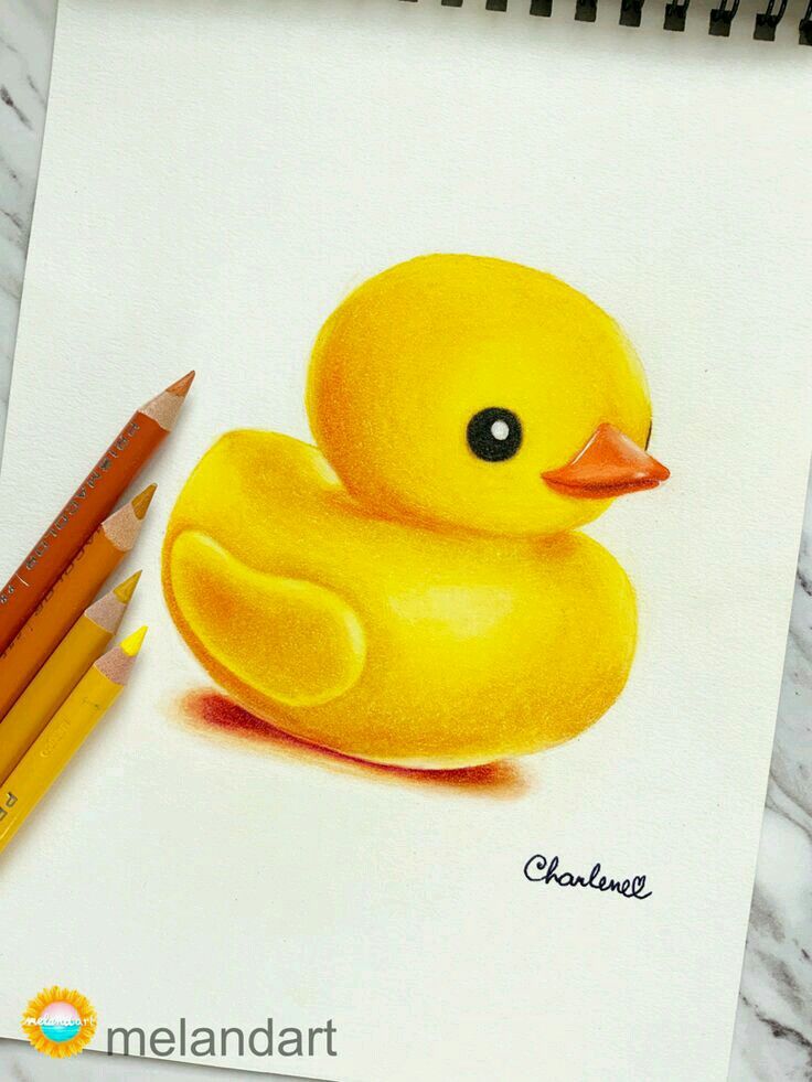 a drawing of a yellow rubber ducky with two colored pencils next to it